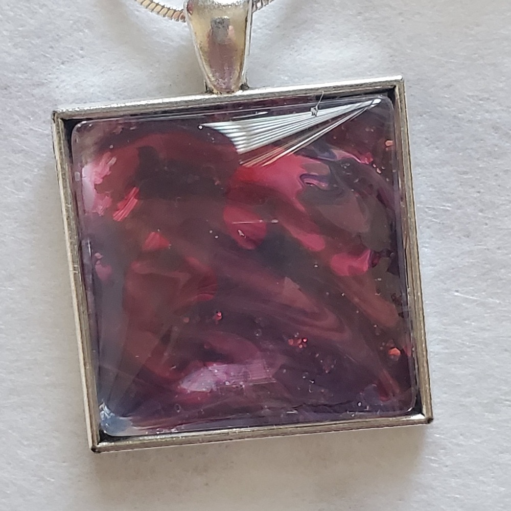 Pendants on sterling chains.